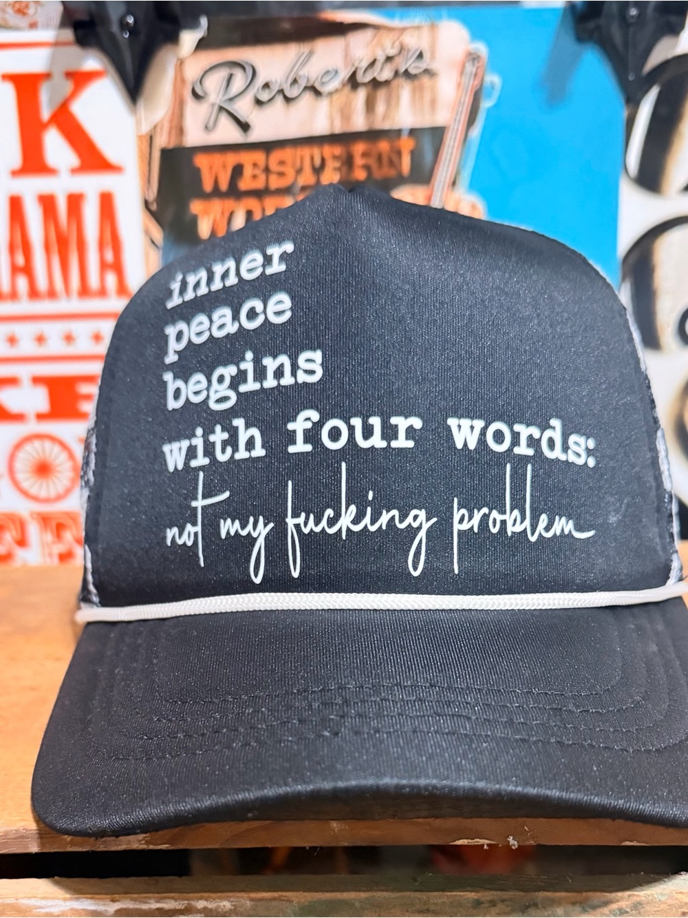 Black Trucker Hat With a humorous phrase